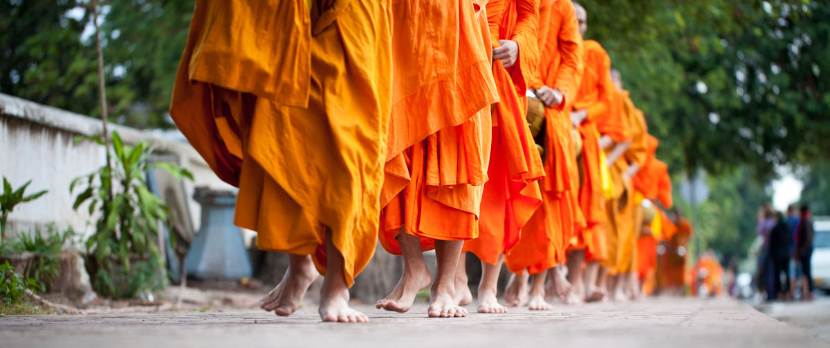 Follow the Laotian monks to receive alms